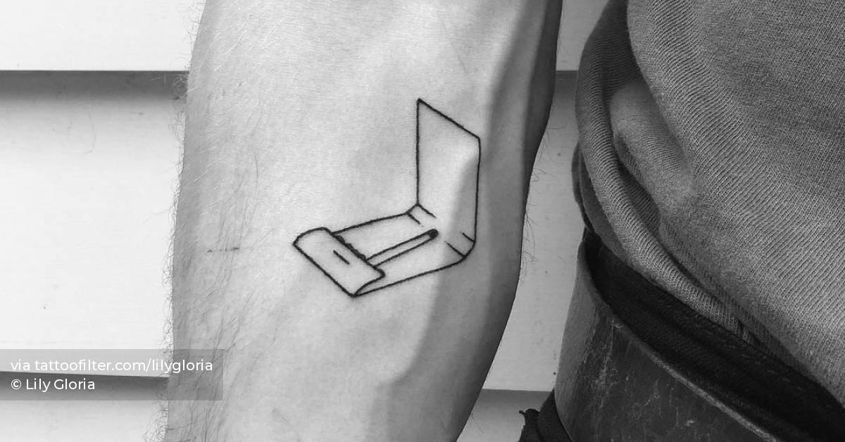 Matchbox tattoo hand poked on the inner forearm.