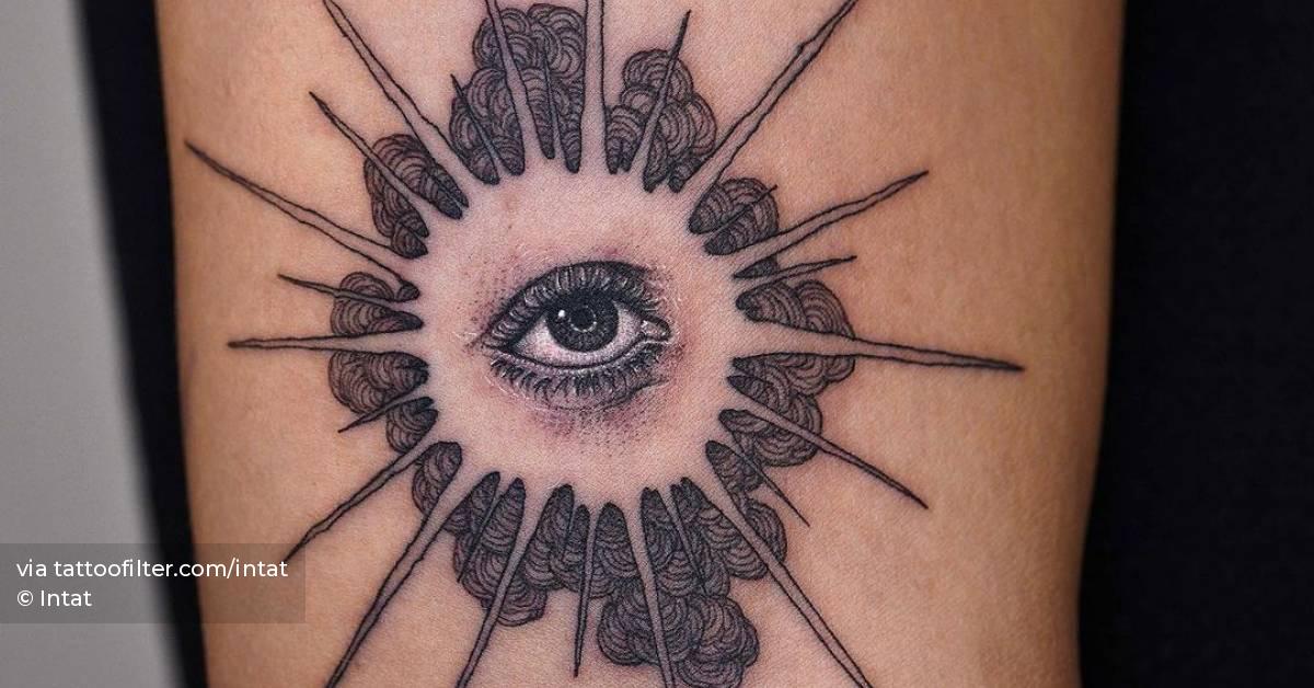 Illustrative style eye tattooed on the upper arm.