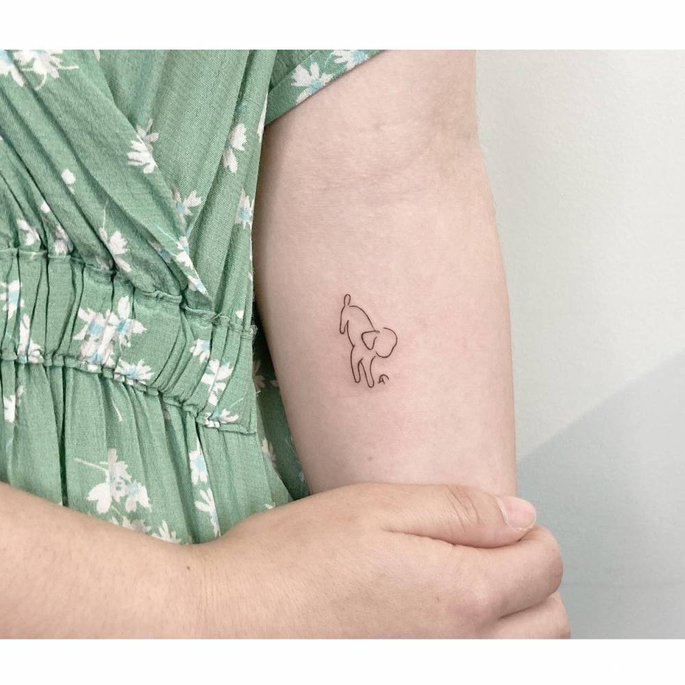 Minimalistic Dog Tattoo Placed On The Inner Forearm 