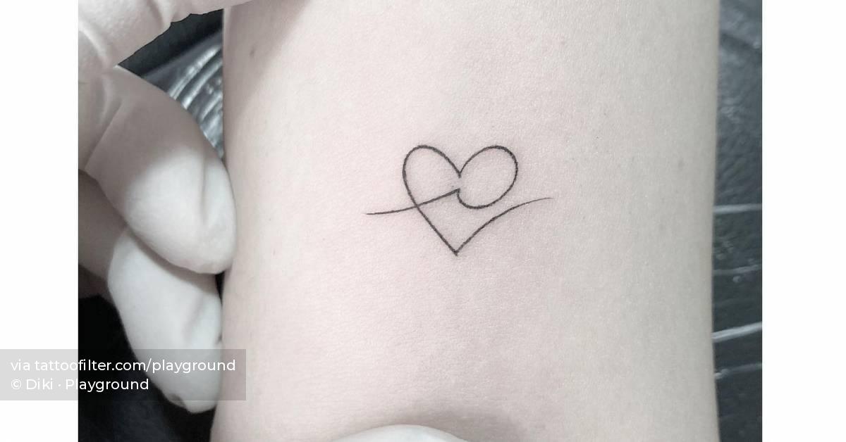 Minimalistic style heart and wave tattoo placed on the