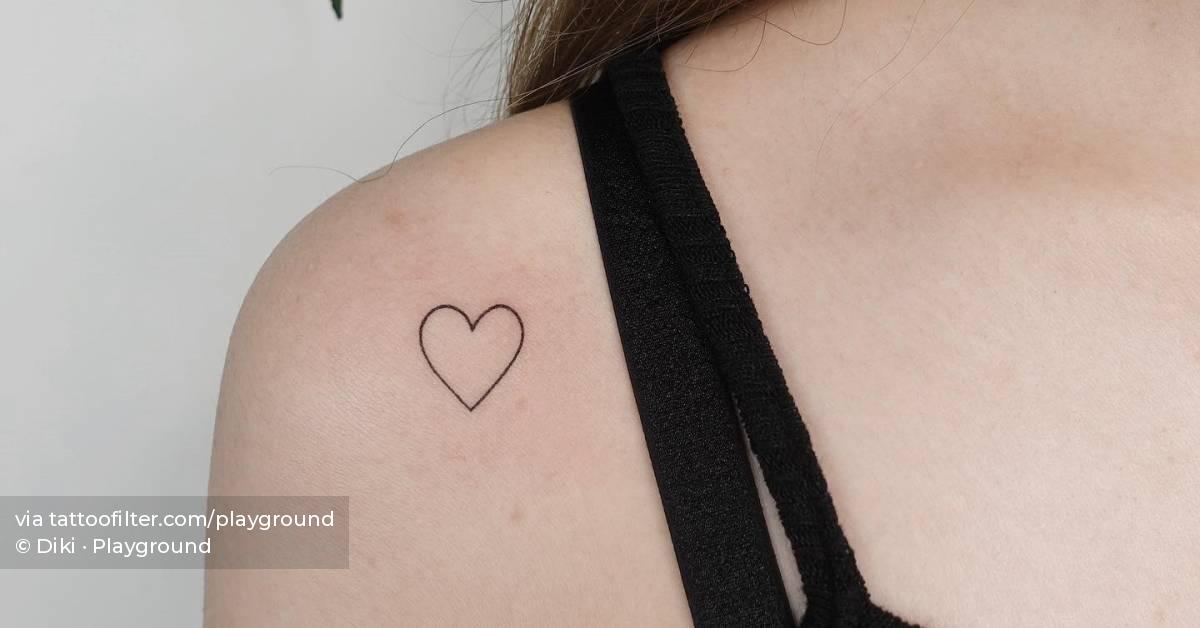 Minimalistic style heart tattoo placed on the shoulder.