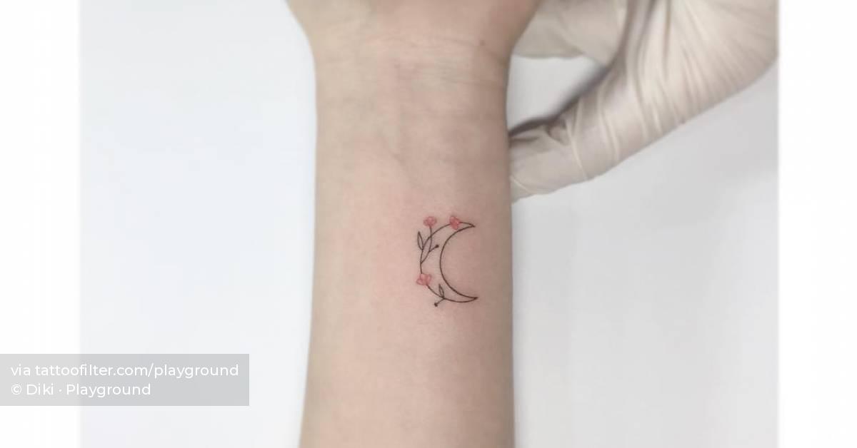 Fine line style flower moon tattoo located on the