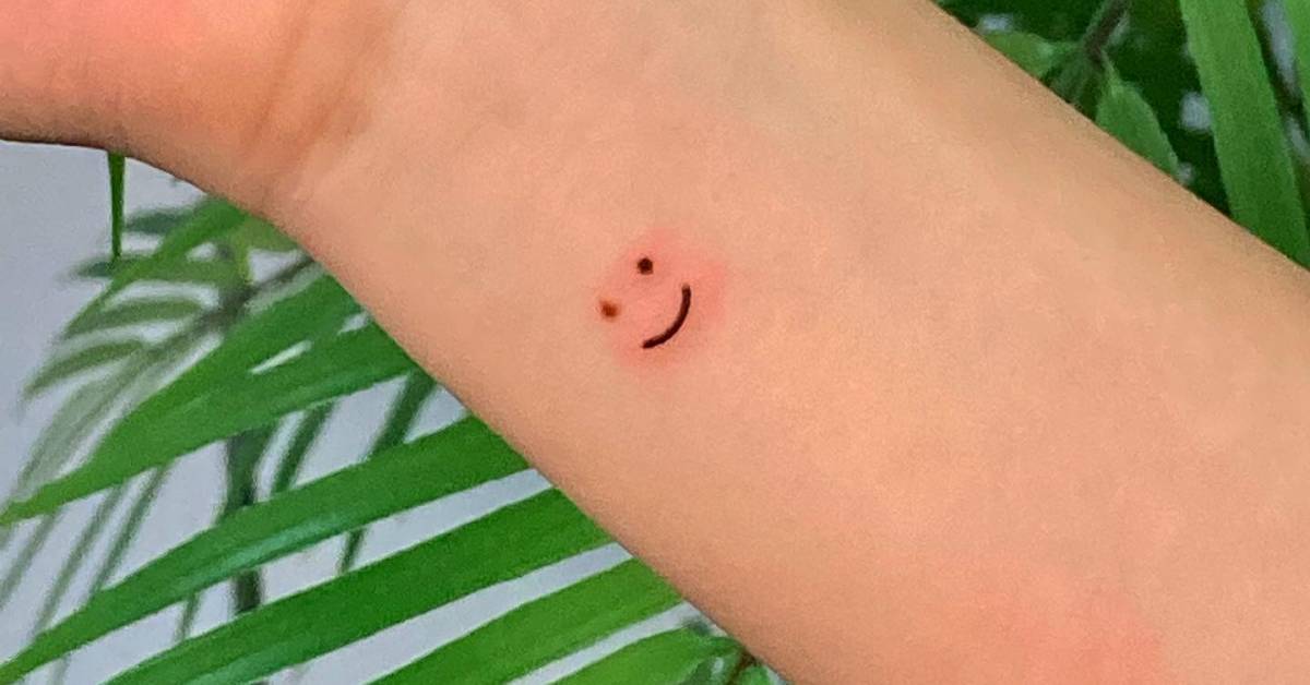 Birthmark cover up smiley face tattoo located on the
