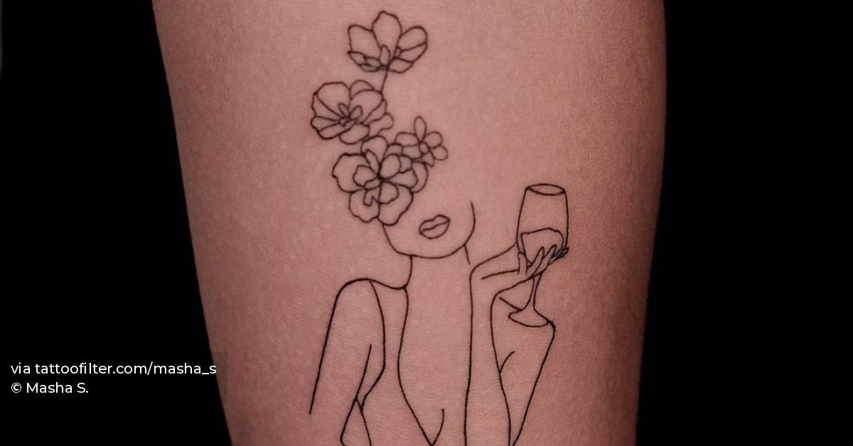 Fine line flower head woman tattoo done on the inner