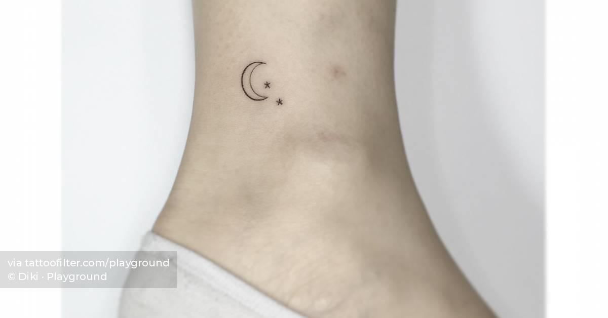 Minimalistic style moon and stars tattoo located on the