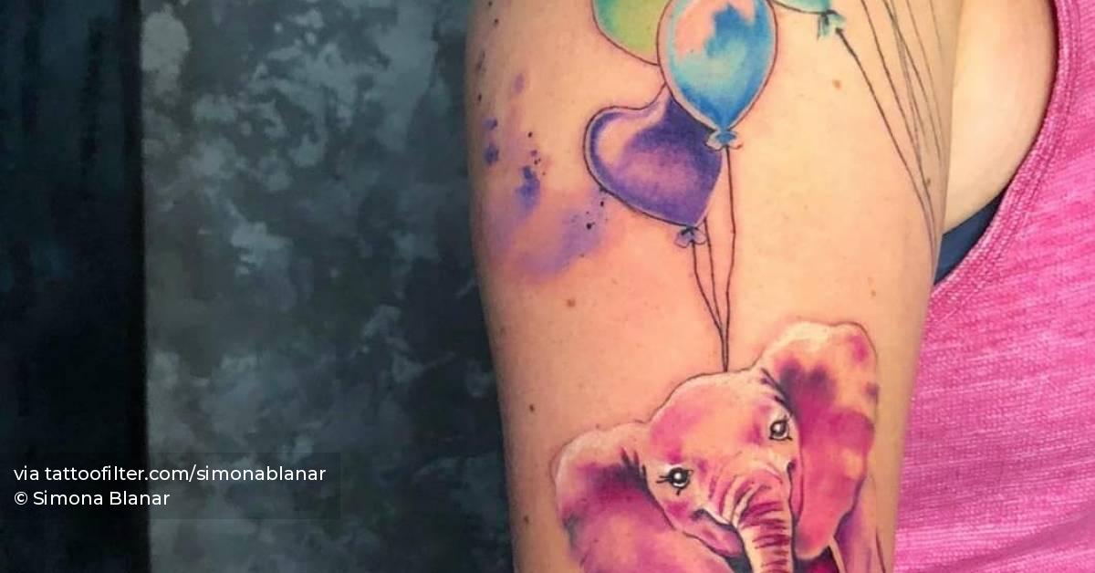 Watercolor style elephant and balloons tattoo done on