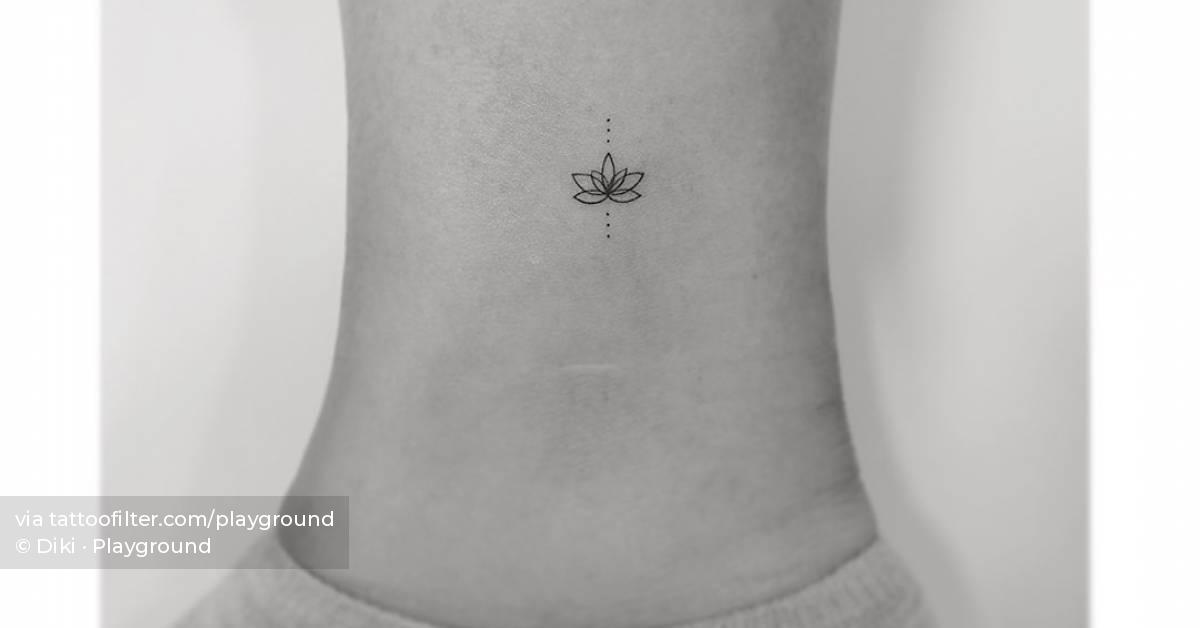 Fine line lotus flower tattoo located on the ankle.