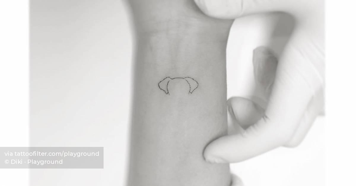 dog-ears-tattooed-on-the-wrist-minimalistic-style