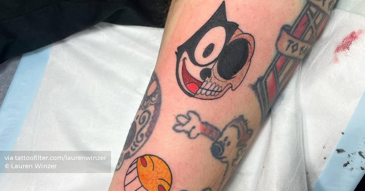 felix-the-cat-and-smiley-face-tattooed-on-thew-bicep