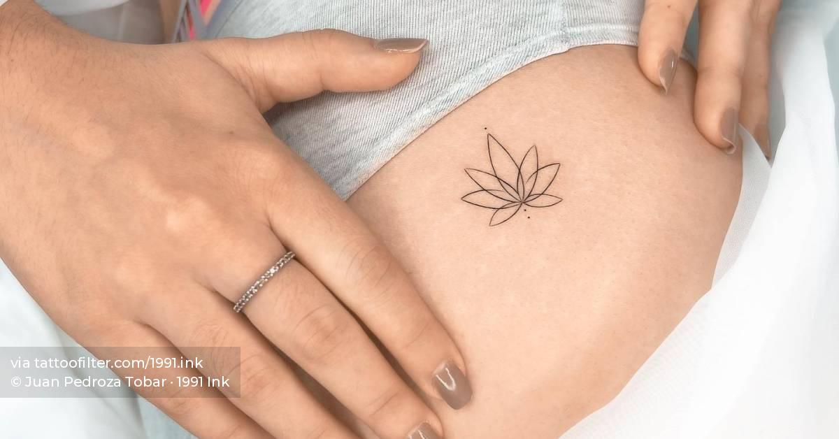 Fine line lotus flower tattoo done on the hip.