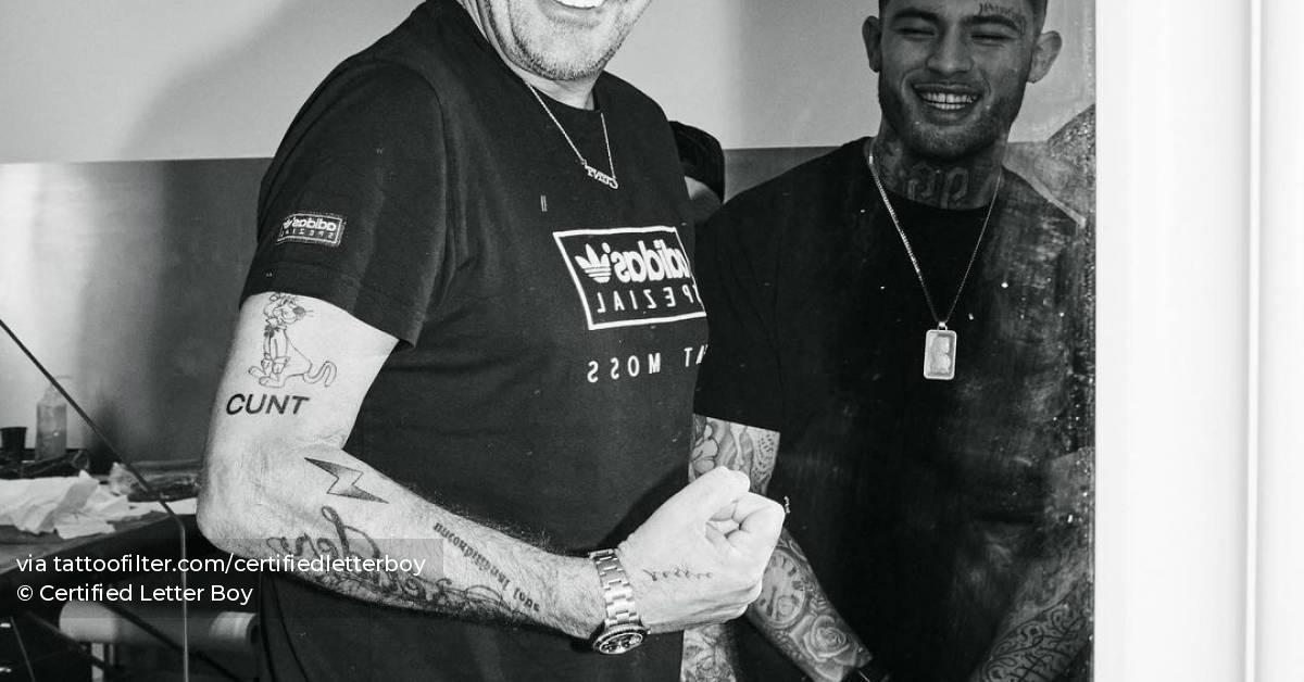 Tattoo of the word cunt located on fat tony s upper