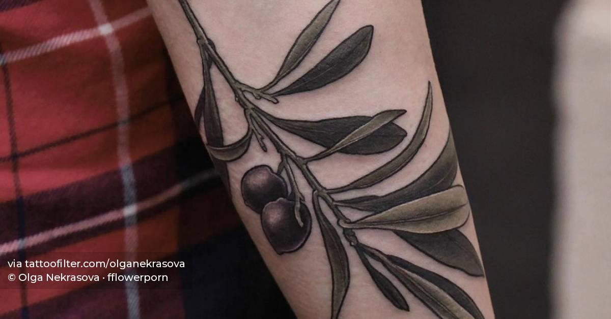 Tattoo of an olive branch done on the forearm.