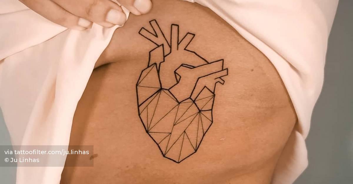 Line art style anatomical heart tattoo located on the