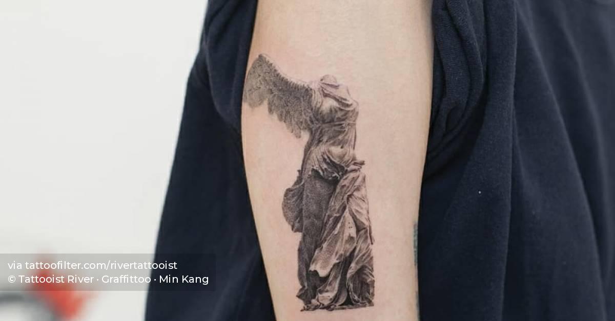 Winged victory of Samothrace tattoo on the upper arm.