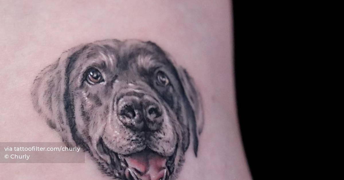 Small black labrador portrait tattoo on the inner