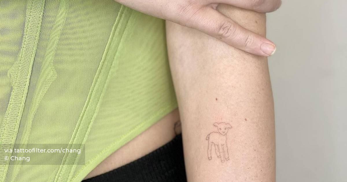 Fine line lamb tattoo on the inner forearm.