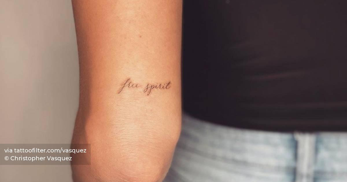  Free Spirit Lettering Tattoo Located On The Tricep 