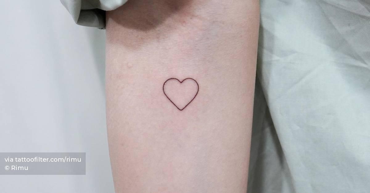 Minimalistic heart tattoo located on the inner forearm.