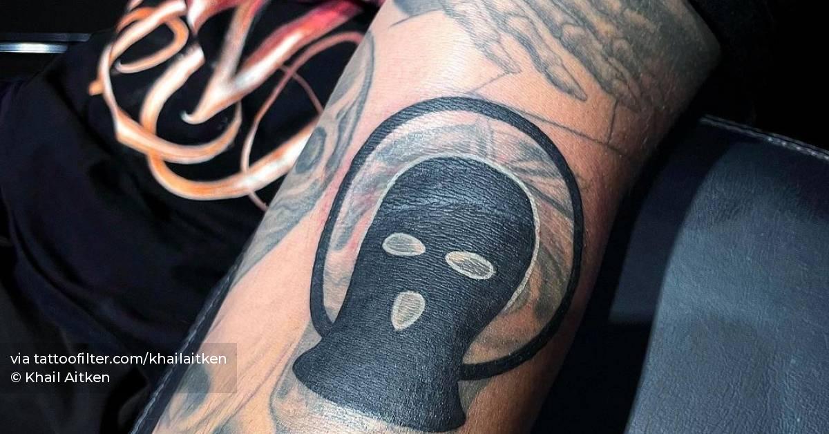 Balaclava tattoo located on the forearm.