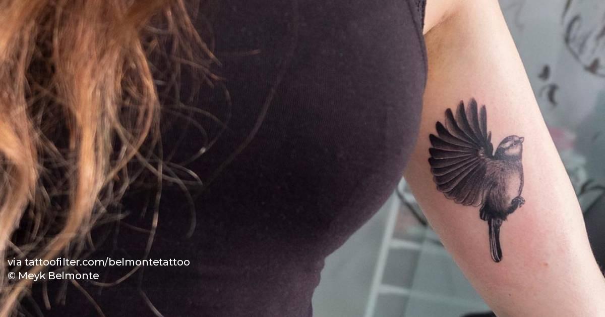 Realistic sparrow tattoo on the inner arm
