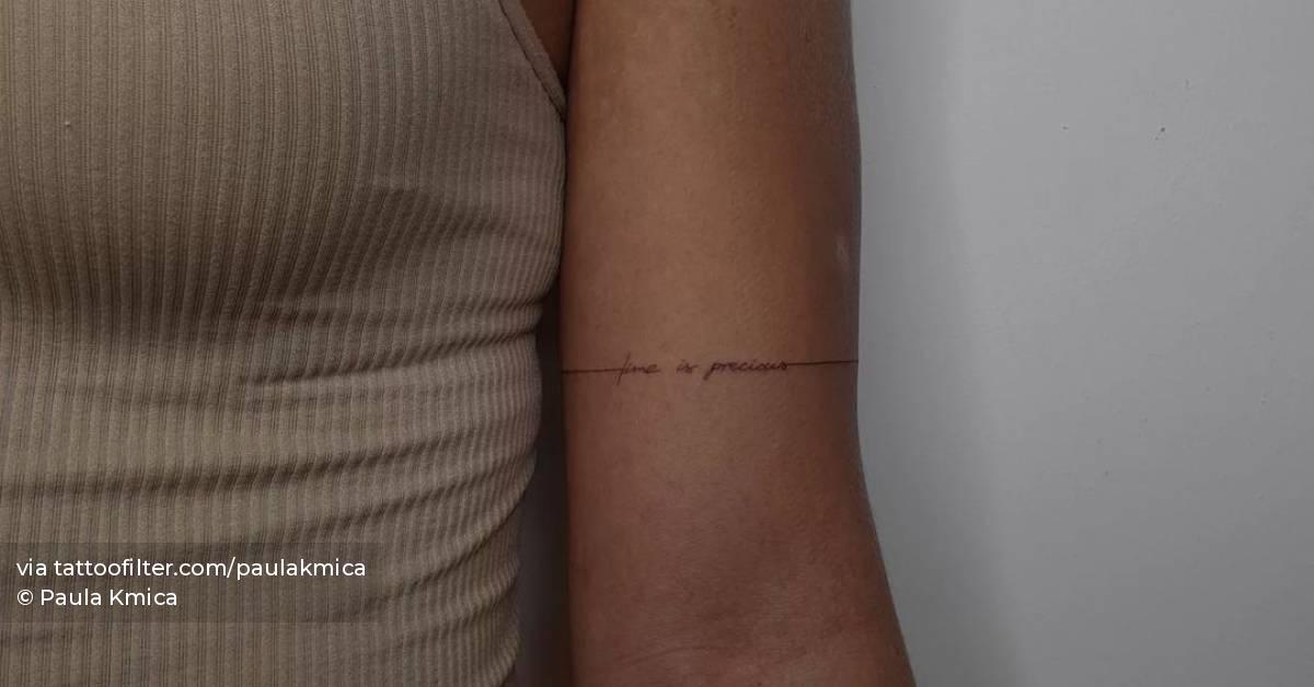 "Time is precious" lettering tattoo handwritten on the