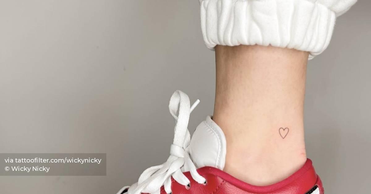 Tiny little heart tattoo located on the ankle,