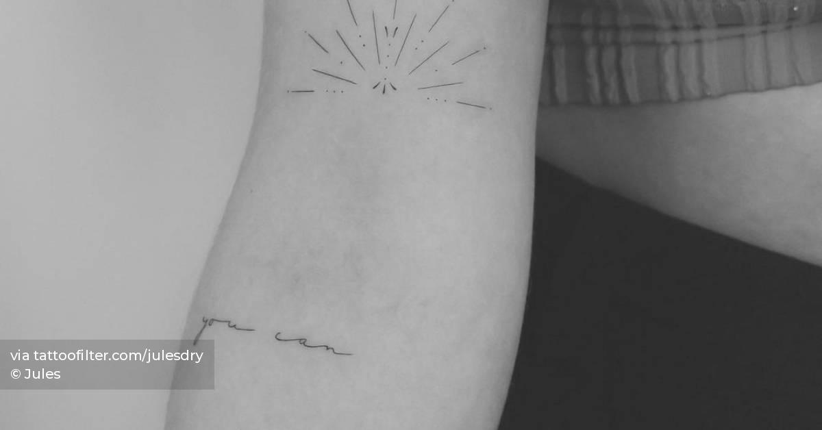 Sun and ‘you can’ tattoos done on the arm.