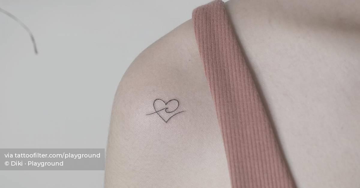 Minimalistic style heart and wave tattoo located on the