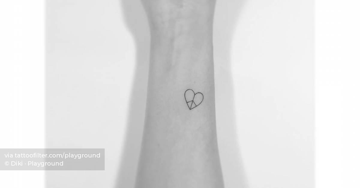 Minimalistic style peace heart tattoo placed on the