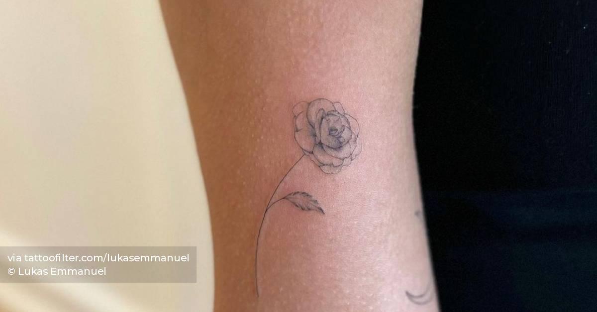 Single needle rose tattoo located on the bicep.
