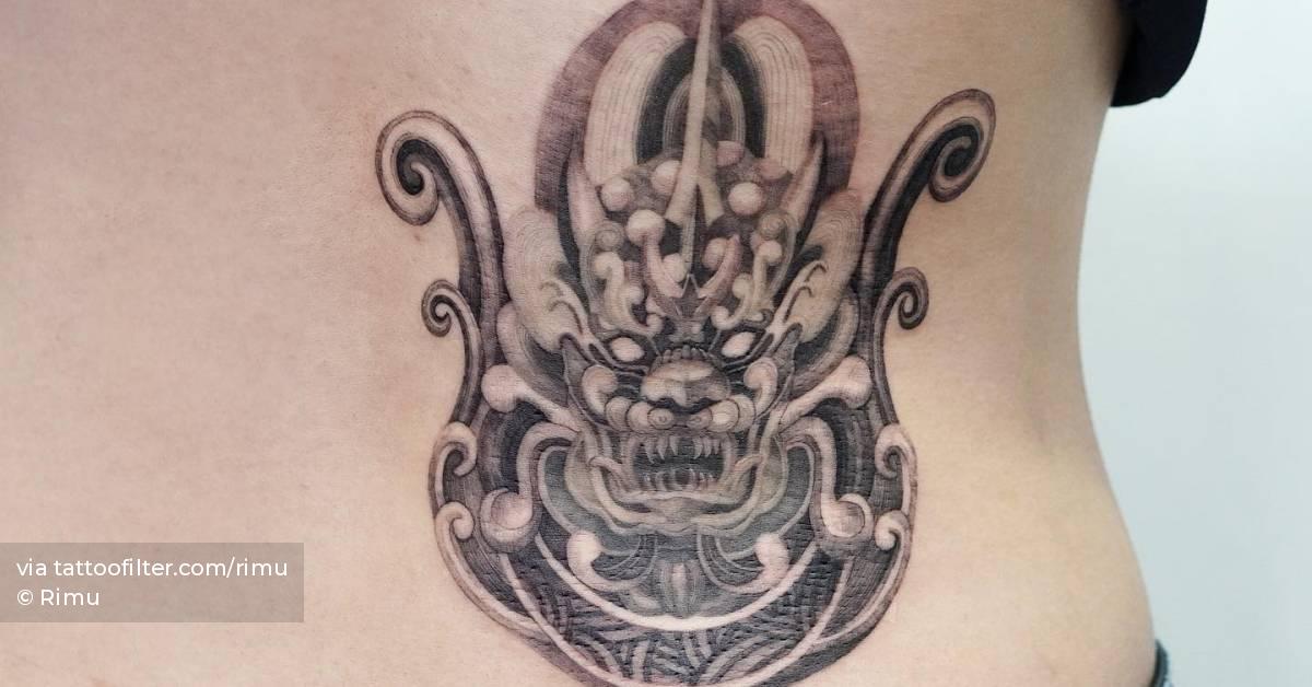 Haetae tattoo located on the lower back.