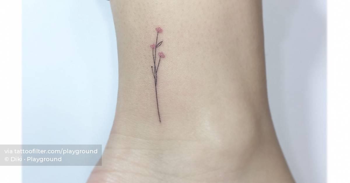 Fine line flower tattoo located on the ankle.