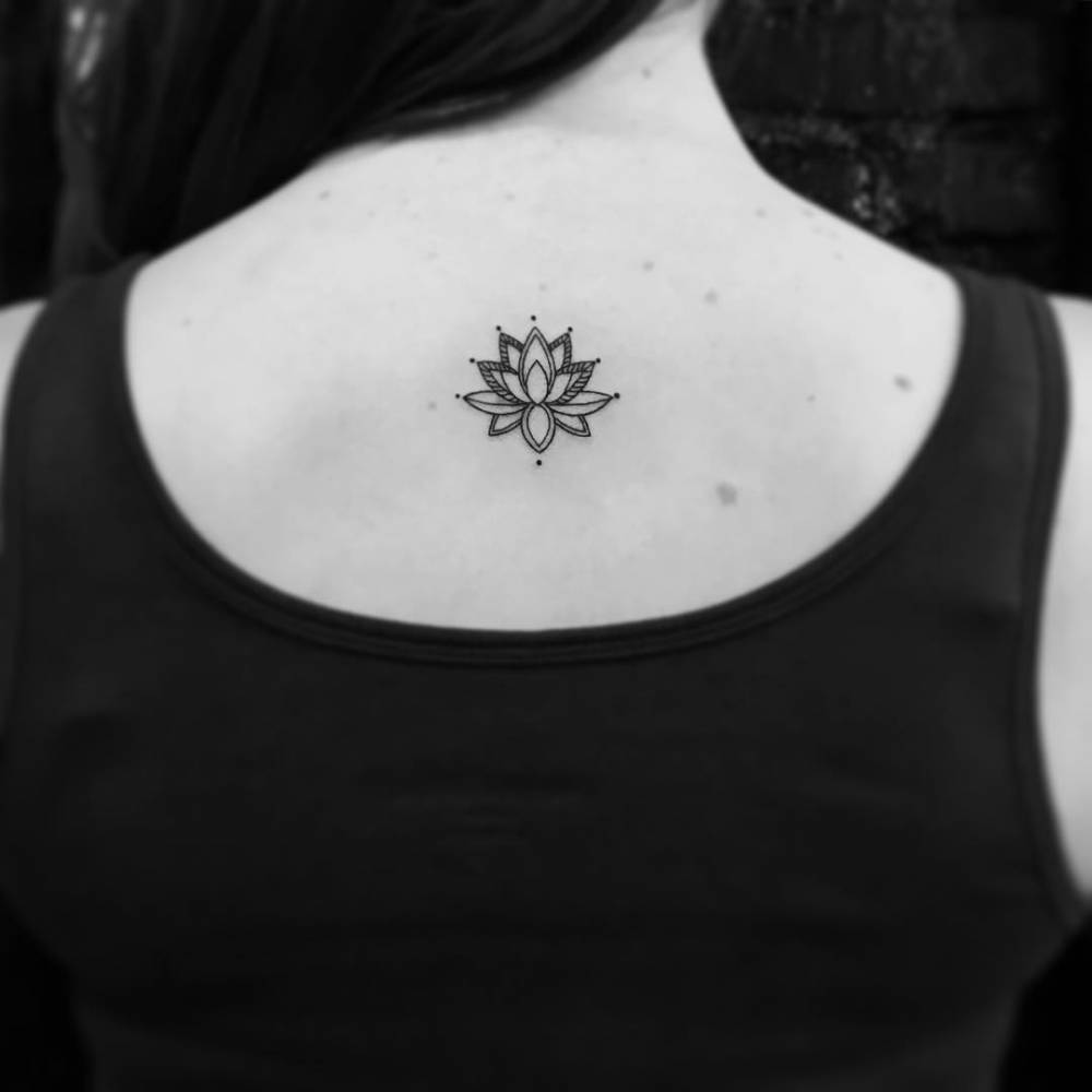 Lotus Flower Tattoo Located On The Upper Back 