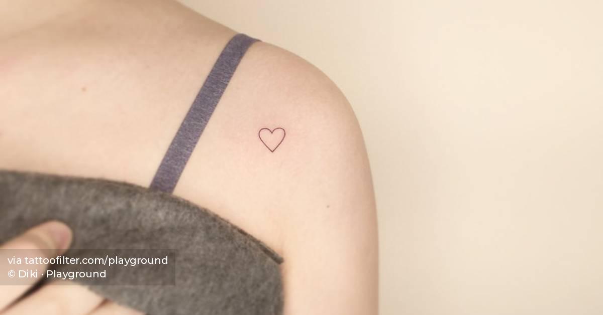 Little minimalistic heart tattoo placed on the