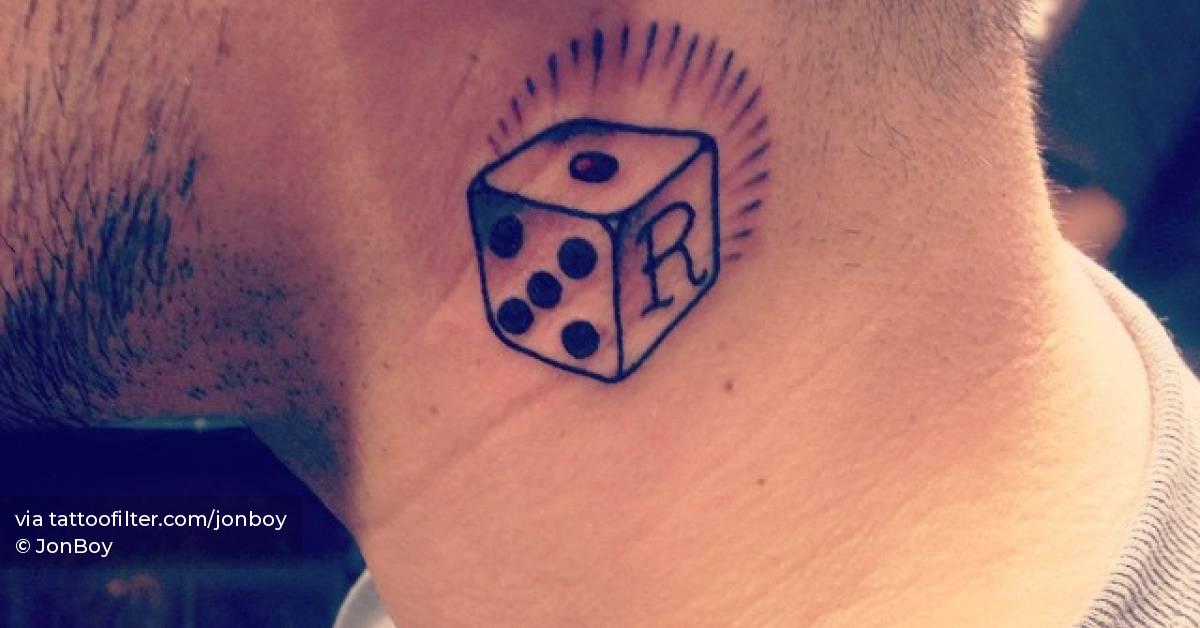 Dice tattoo located on the neck.