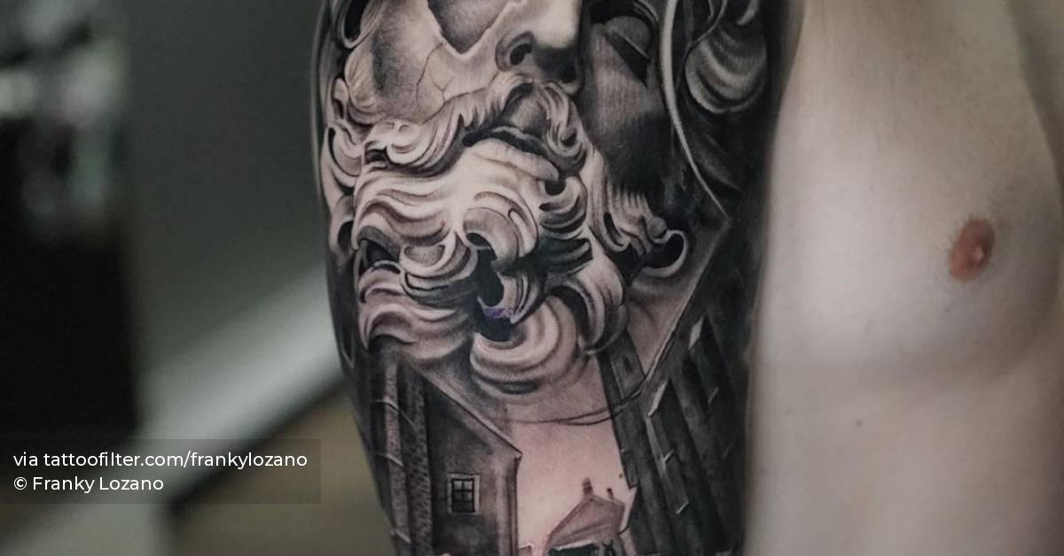 Black and grey Zeus portrait tattoo located on the