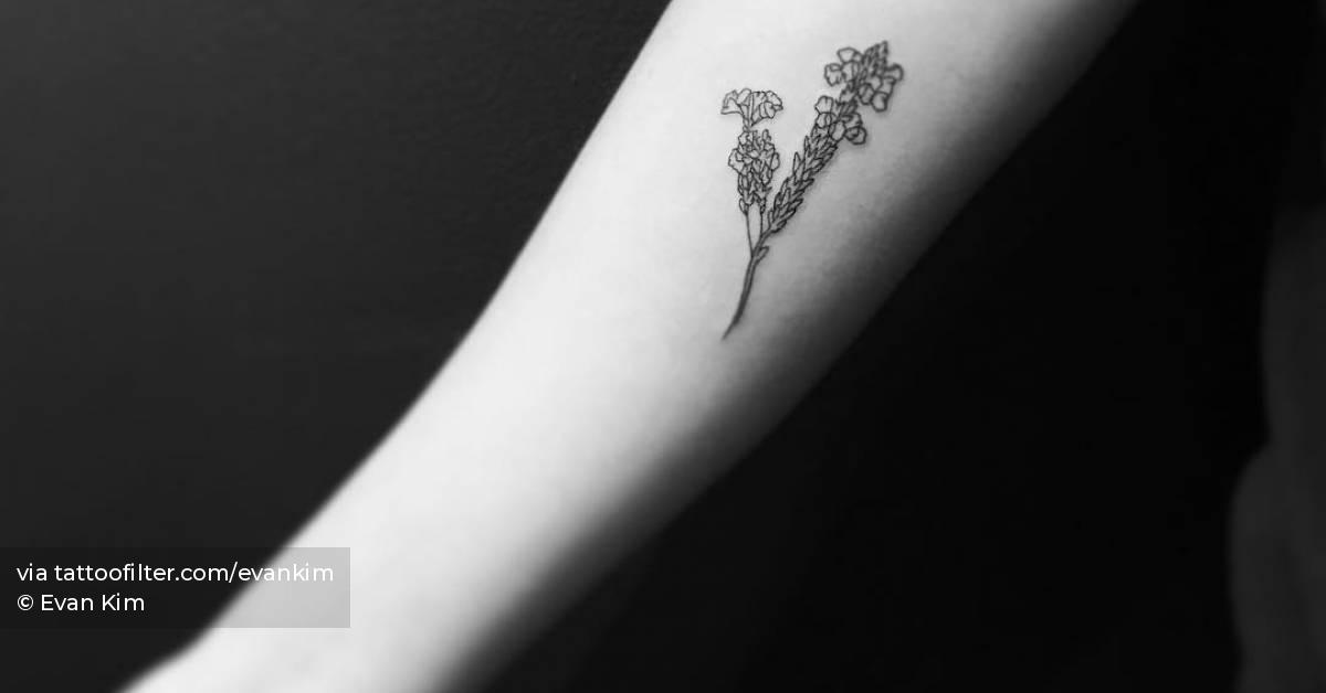 Fine line style flower bouquet tattoo located on the