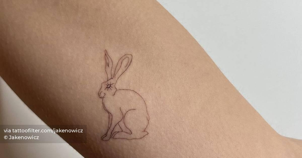 Single needle rabbit tattoo located on the inner arm.