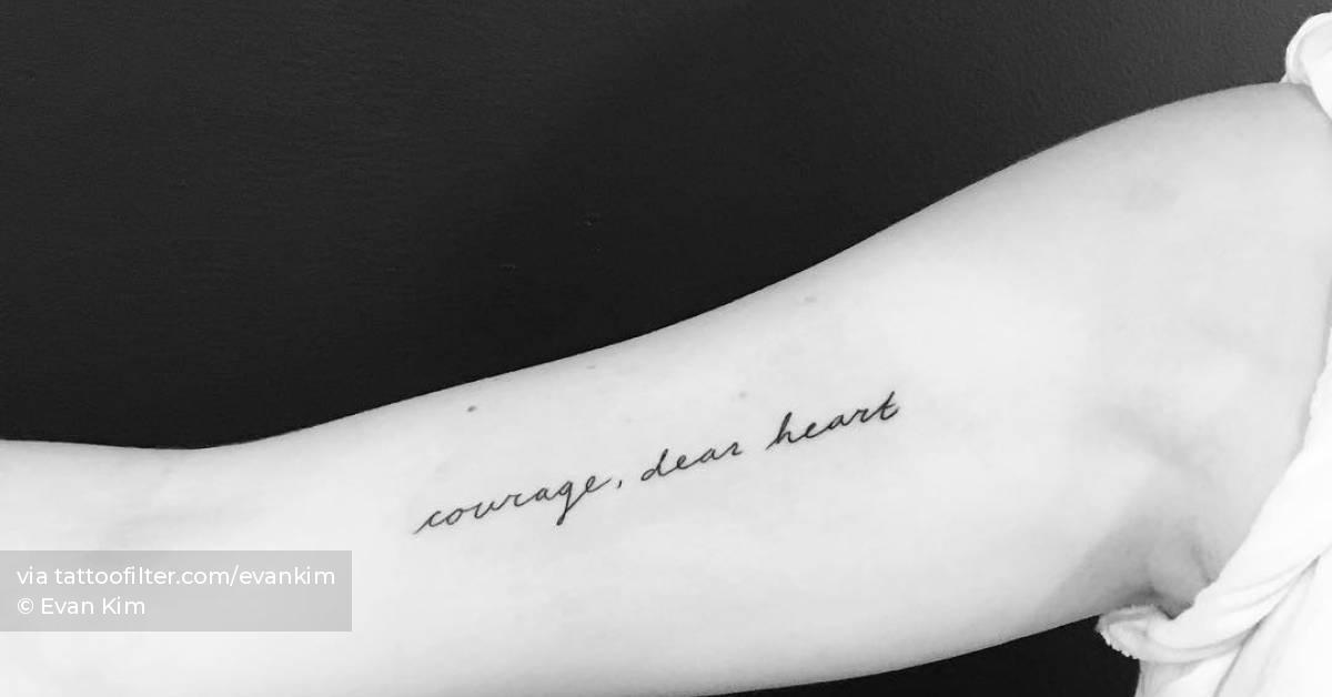 "Courage, dear heart" lettering tattoo handwritten on