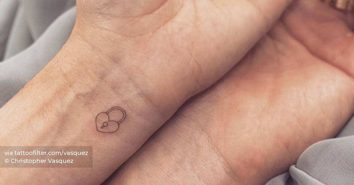 Matching lock and key tattoo for couple.