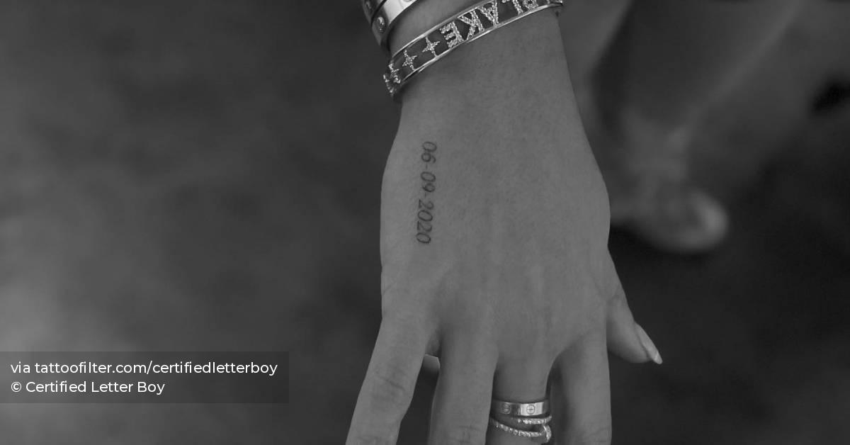 date-tattoo-located-on-the-hand