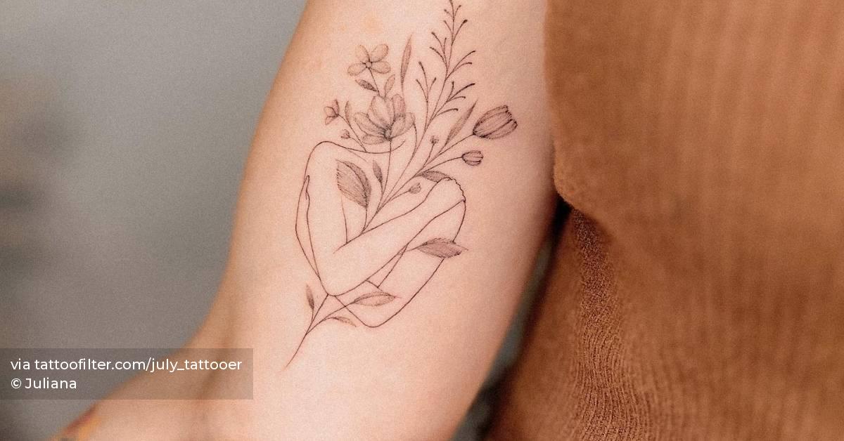 Flower head woman tattoo located on the inner arm, fine