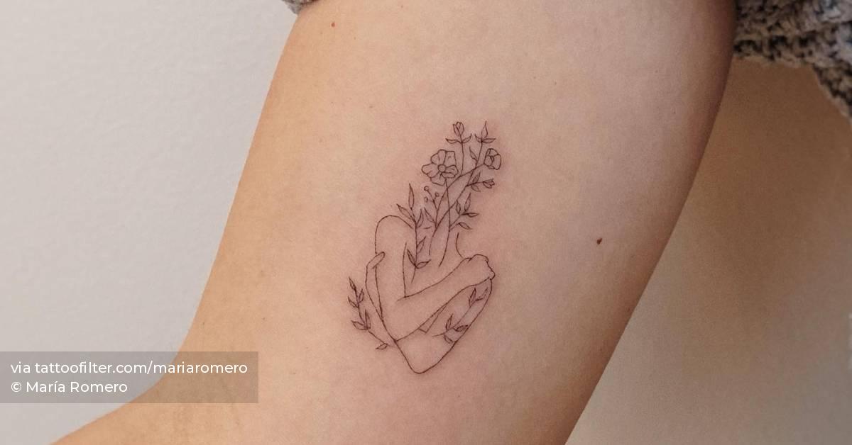 Flower head woman tattoo located on the inner arm, fine