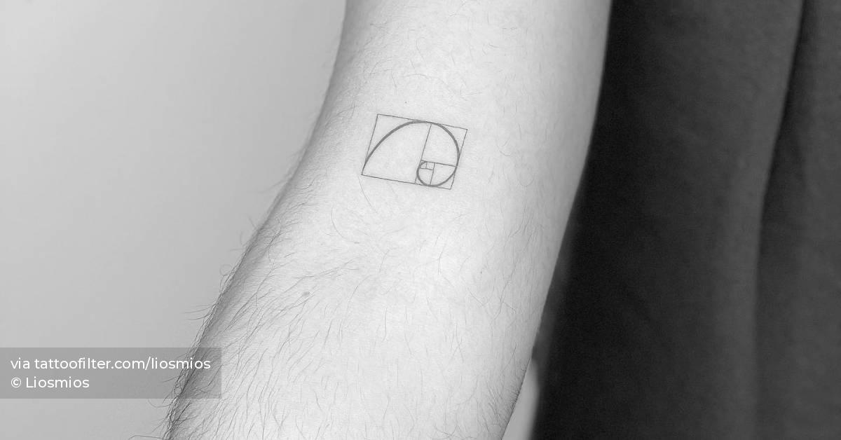 Minimalistic style golden spiral tattoo located on the
