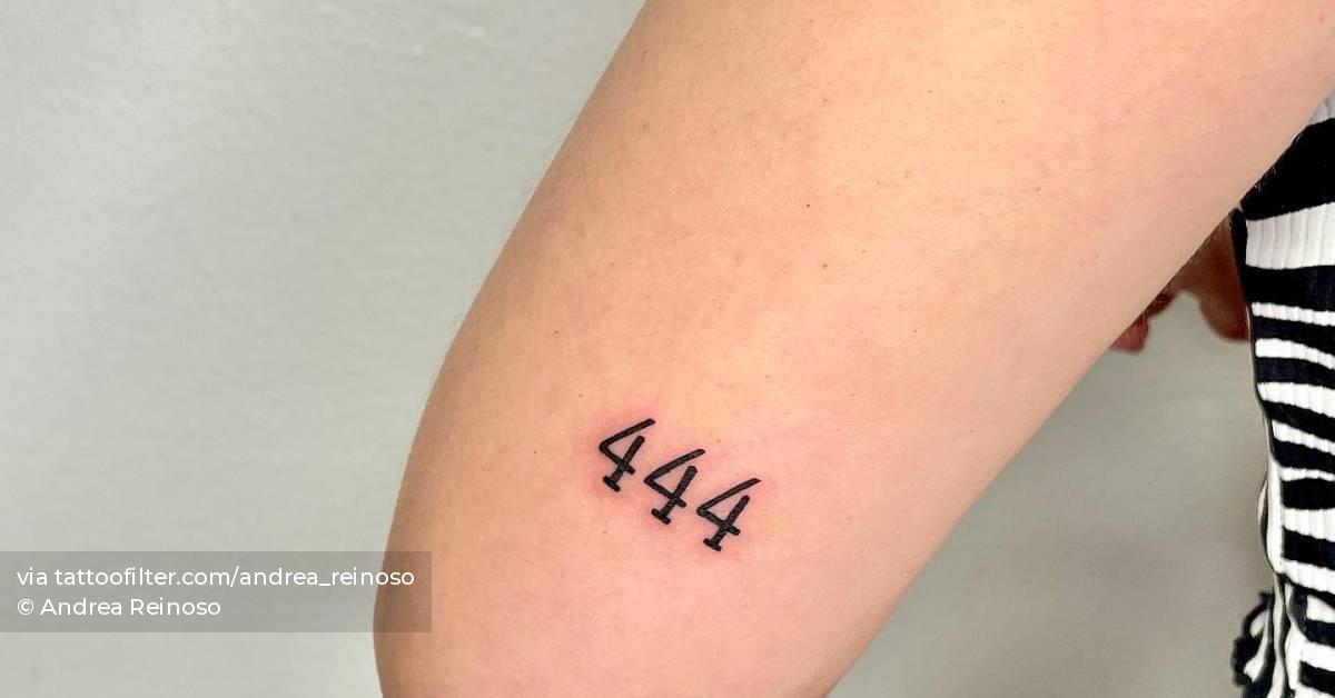 Angel number "444" tattooed on the tricep.