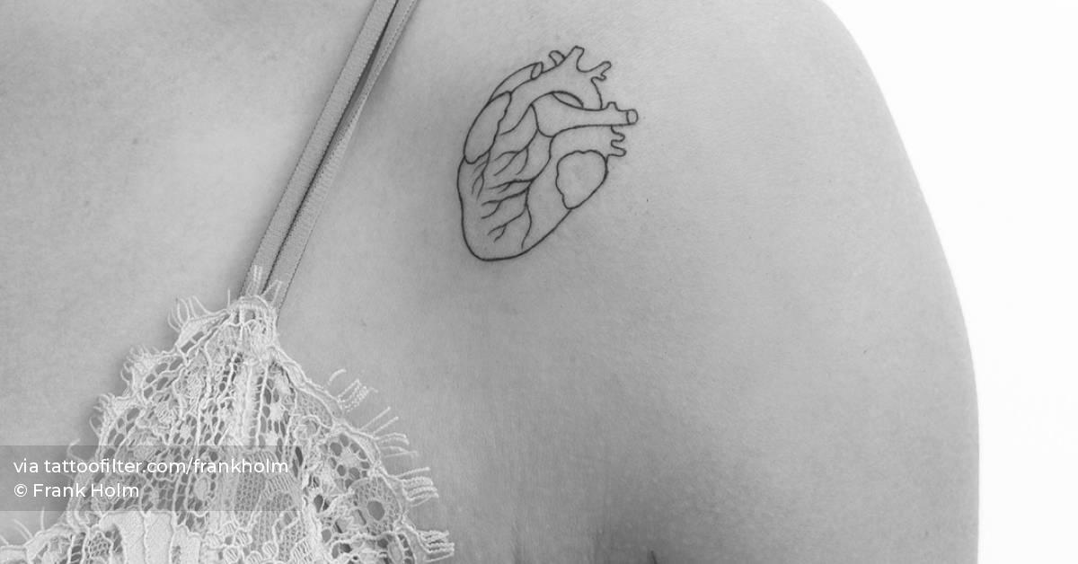 Fine line style anatomical heart tattoo located on the