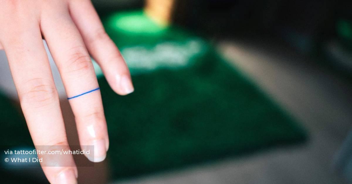 minimalistic-style-blue-ring-tattoo