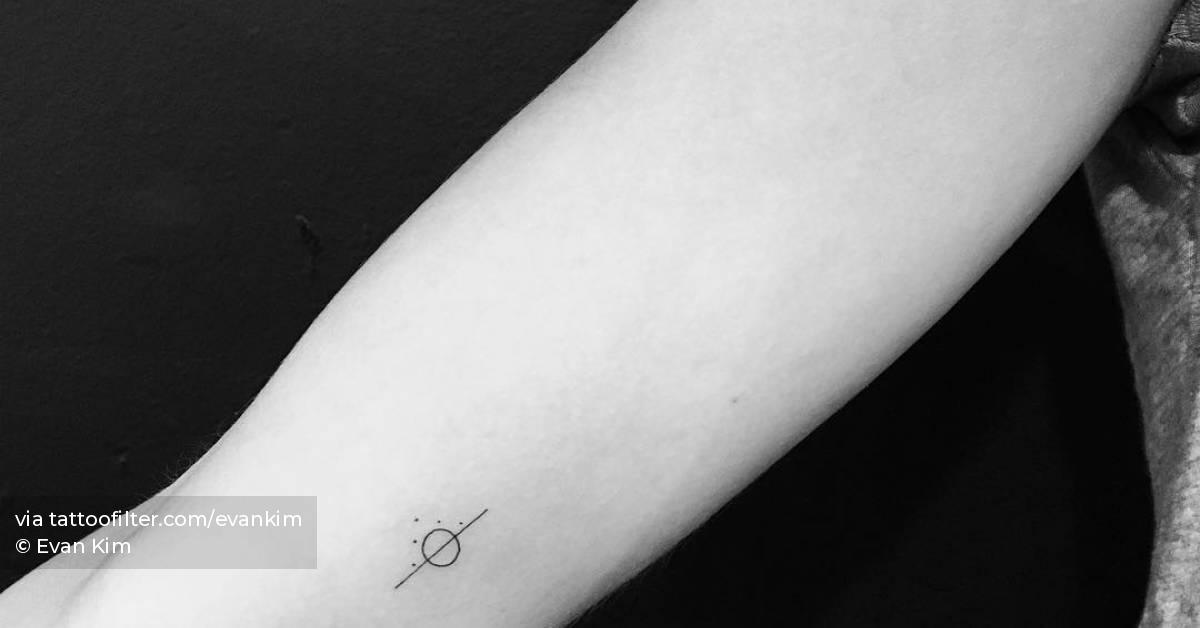 Minimalistic line, circle and dots tattoo located on