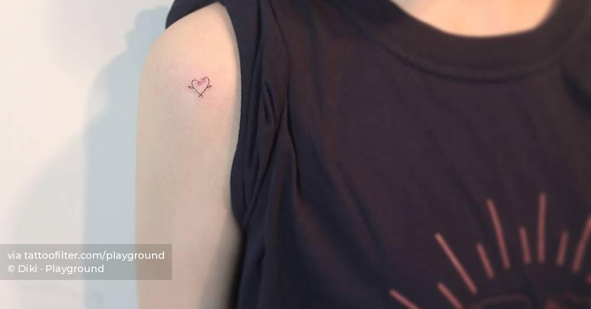 Minimalistic style flower heart tattoo located on the