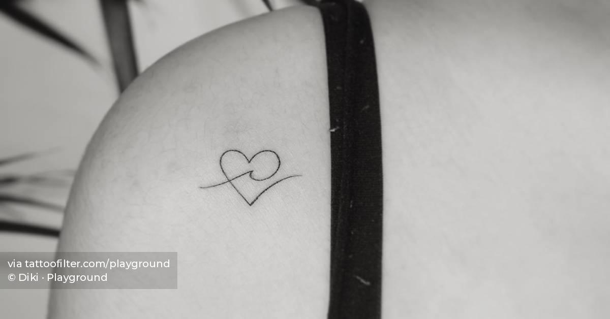 Minimalistic wave and heart tattoo located on the